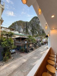 a restaurant with a view of a mountain at AMIGOS Hostel El Nido in El Nido