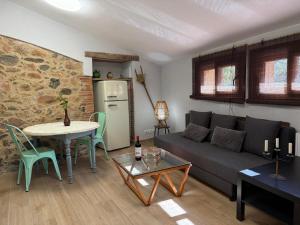 a living room with a couch and a table at Nova Forest Montseny in Montseny