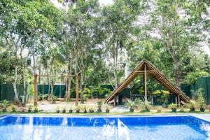 a tent in front of a swimming pool at Villa Hatange in Weligama