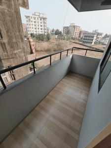 a balcony with a view of a city at Comfort nest in Manipal in Manipal