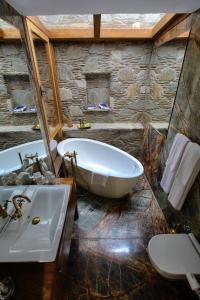 a large bathroom with a tub and a sink at Ibri Hotel in Selcuk +62 photos