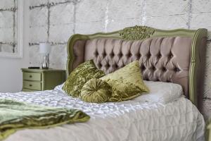 a bed with two pillows on top of it at Washington Beach House with Lodge in Heacham