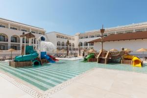 a pool with slides and a water park at Hotel Best Village Chipiona in Costa Ballena