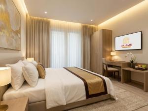 a hotel room with a bed and a desk at Dahabi Airport Hotel Era in New Delhi