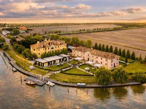 an aerial view of a house on an island in the water at Agriturismo Villa Anconetta in Loreo