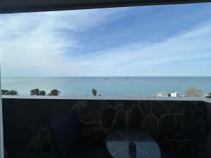 a view of the ocean from a balcony at Touch the Coast in Batumi