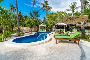 an image of a swimming pool at a villa at Ings Garden Acommodation in Gili Islands +33 photos