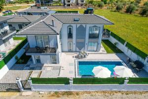 an aerial view of a house with a swimming pool at Villa Egeden 2 in Fethiye