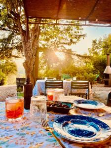 a table with plates of food on top at Agriturismo CasaViVa in Pozzo