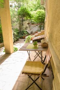 a table and chairs sitting on a patio at TOMOVI HOME - Three bedrooms City center in Plovdiv