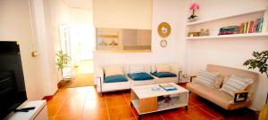 a living room with a couch and a table at Casa Playa Moncofa in Moncófar