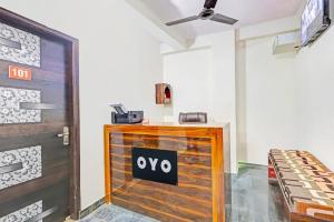 a sign on a wooden door in a room at Hotel o Skylight in New Delhi +9 photos
