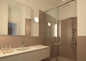 a bathroom with a sink and a shower at Moshoviti Residence in Rethymno +36 photos