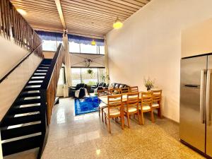 a kitchen and dining room with a table and chairs at Villa Cuisine in Joensuu