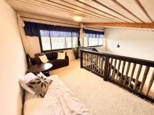 a living room with a bed and a couch at Villa Cuisine in Joensuu