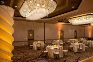 a banquet hall with white tables and chandeliers at Walnut Creek Marriott in Walnut Creek +54 photos