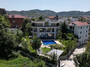 an aerial view of a house with a swimming pool at Villa Florence in Tirana