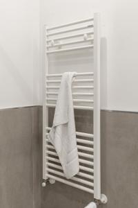a towel rack in a shower in a bathroom at Terrasini Center Apartments By Dimora Hub in Terrasini +211 photos