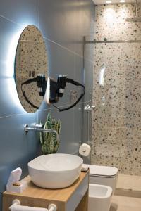 a bathroom with a sink and a shower at Giada Luxury Terrasini in Terrasini