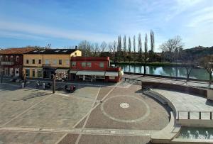 a city square with a building and a river at Antica Jesolo - M Factory in Jesolo