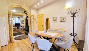 a dining room with a table and chairs at TOMOVI HOME - Three bedrooms City center in Plovdiv