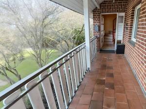 a balcony of a home with a view of a yard at Ferienwohnung Hoher Pön in Willingen