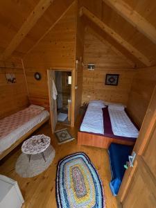 an overhead view of a log cabin with two beds at Matesevo guest houses in Kolašin