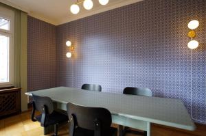 a meeting room with a table and chairs at ReLiving - Historic City Apartment in Lucerne