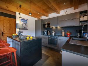 a kitchen with a sink and a counter top at Chalet Sivara - OVO Network in Manigod +20 photos