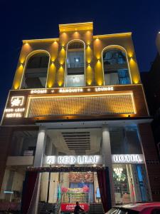 a red leaf hotel with lights on top of it at Red Leaf Hisar in Hisār