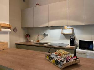 a kitchen with a counter and a counter top with a counter sidx sidx at LHE Terrazza Alba in Bagno di Romagna
