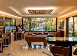 a living room with a pool table and a pool table at Villa Turrion in Marbella