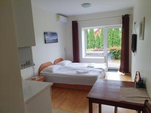 a small bedroom with a bed and a window at Love Island 2 in Druskininkai +56 photos
