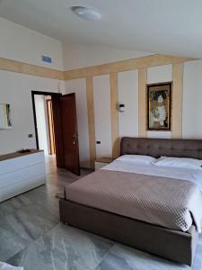 a large bedroom with a large bed in it at Hotel-Ristorante KerMes in Boccaleone