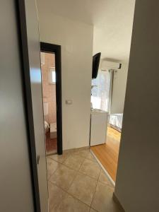 a hallway with a door leading to a living room at Villa Ivanovic in Budva