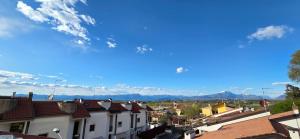 a view of a town with houses and mountains at Mars' apartment in Cavalcaselle