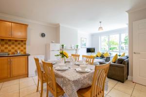 a kitchen and dining room with a table and chairs at Spacious 4-Bed Central Limerick Group Retreat in Limerick