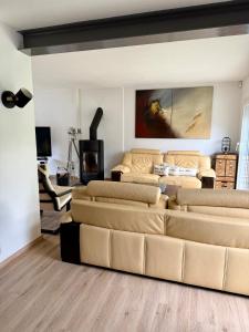 a living room with a couch and a fireplace at Villa Bretagne 5 chambres doubles 3 SDB in Plérin