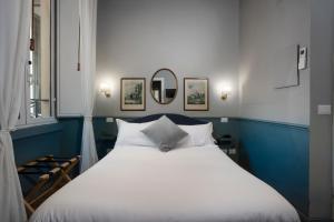 En eller flere senge i et værelse på Hotel donna Francesca