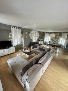 a large living room with a large couch and a table at Villa Palmyra in Nydri +47 photos