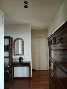 a room with a table and a mirror and a door at Charming 96m2 fantastic view in Tourcoing +3 photos