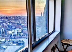 a view of a city from a window at Charming 96m2 fantastic view in Tourcoing