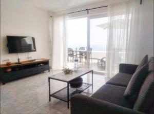 a living room with a couch and a table at La Mar in Los Realejos