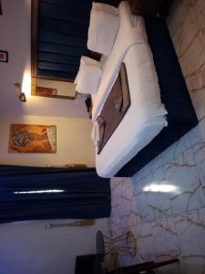 a bed is hanging from the ceiling of a room at Mar'maris Residence Hotel in Owerri