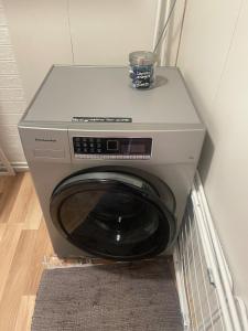 a washing machine with a bowl on top of it at Vestra Fíflholt Cabin 4 in Hvolsvöllur