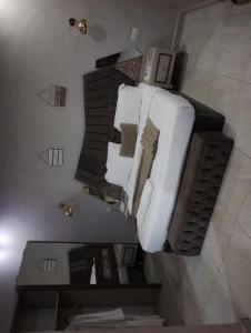 an overhead view of a white couch in a room at Mar'maris Residence Hotel in Owerri