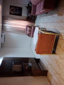 an overhead view of a bathroom with a bench and a sink at Mar'maris Residence Hotel in Owerri +27 photos