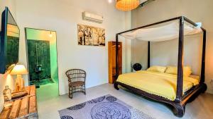 a bedroom with a canopy bed in a room at Cargo Remote Mui Ne in Phan Thiet +26 photos