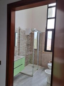 a bathroom with a shower and a toilet at Hotel-Ristorante KerMes in Boccaleone +17 photos