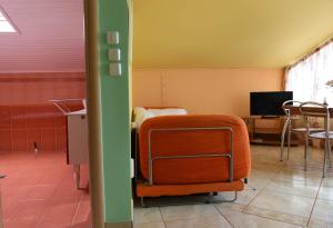 a room with a bed and a chair in it at Hotel Dias Apartment in Makrygialos
